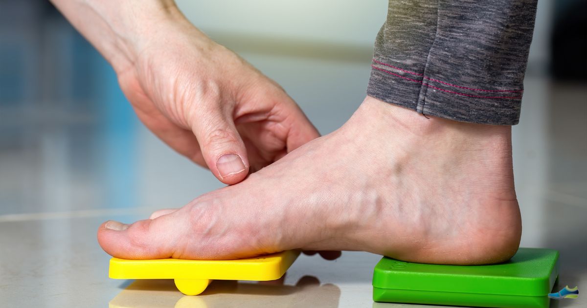 Doctor examining the causes of flat feet