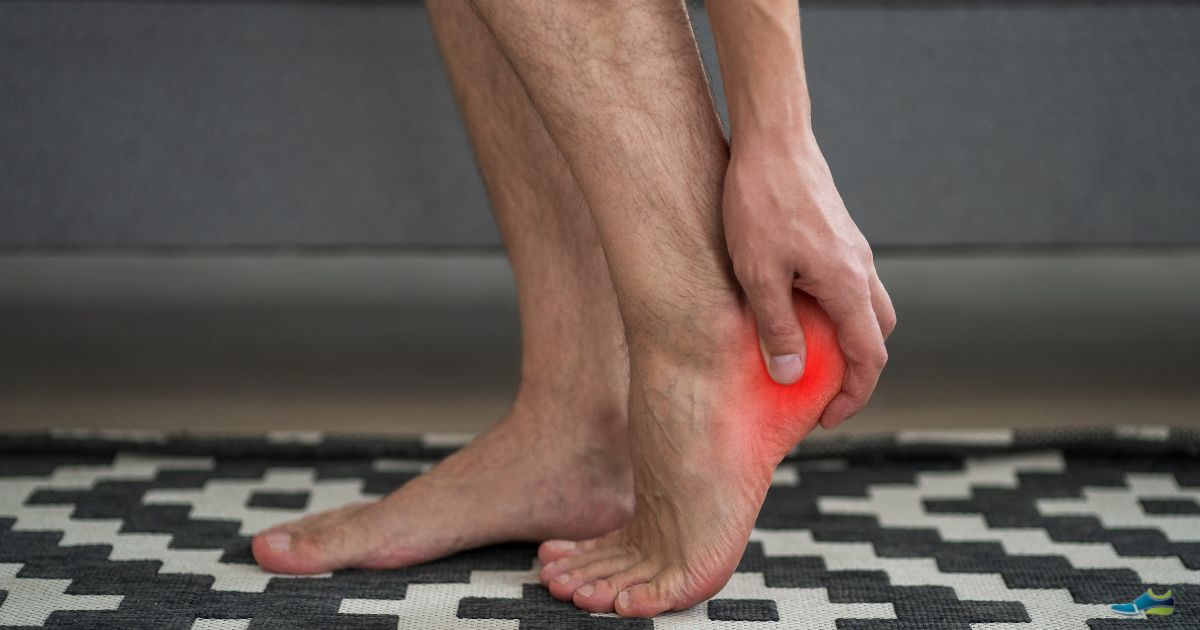 a man rubbing the bottom of his heel - are heel spurs painful